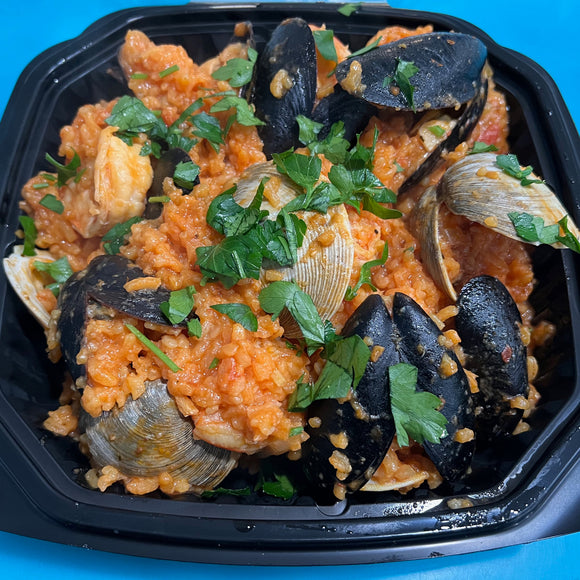 Blue Water Fish Mock Paella - Shrimp, Clams, Mussels mixed with yellow rice, parsley